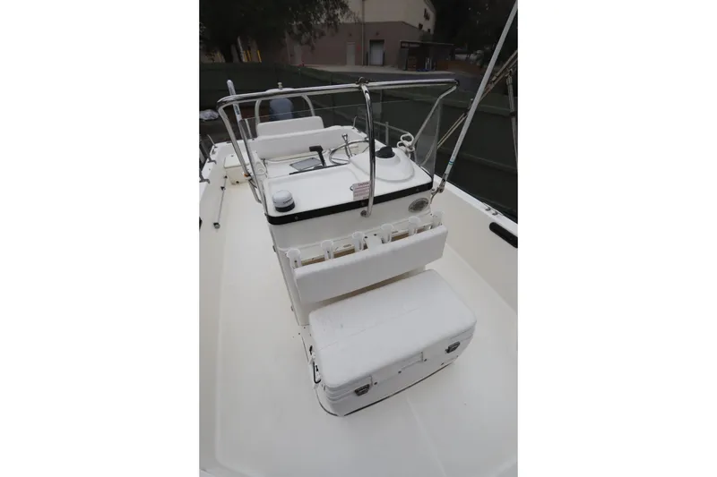 Slide: The Image of 2013 Boston Whaler 210 Montauk boat interior with console and seating. - 11