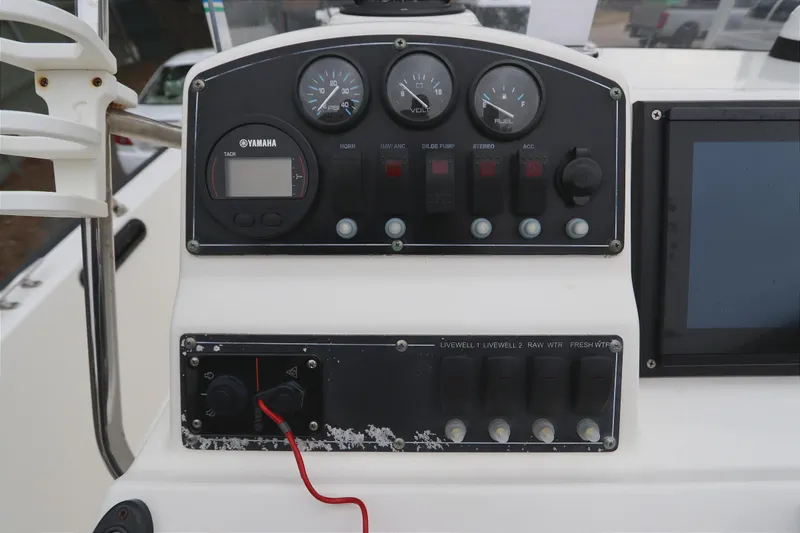 Slide: The Image of Control panel of a 2013 Boston Whaler 210 Montauk boat with Yamaha gauges. - 14
