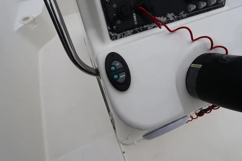 Slide: The Image of Control panel of a 2013 Boston Whaler 210 Montauk boat, featuring Yamaha components. - 17