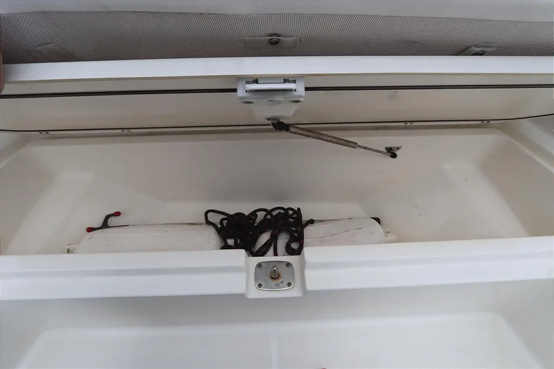 Slide: The Image of Open storage compartment in 2013 Boston Whaler 210 Montauk boat with rope inside. - 18