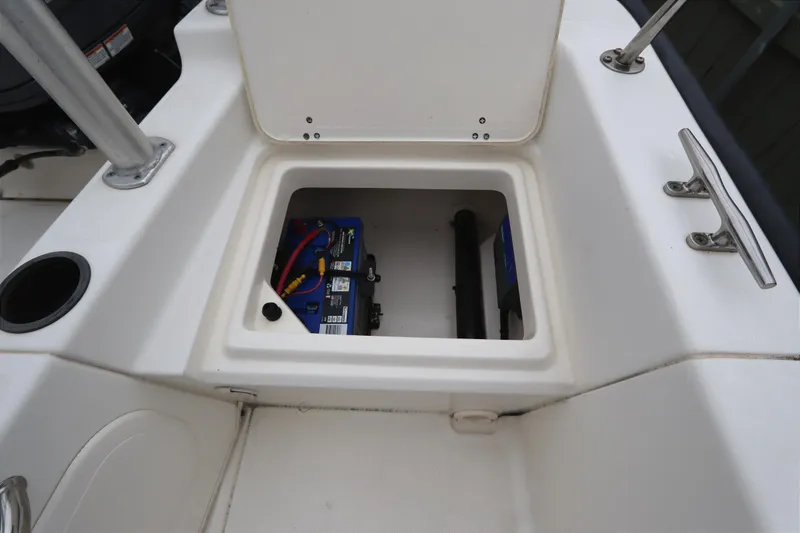 Slide: The Image of 2013 Boston Whaler 210 Montauk boat storage compartment with battery inside. - 23