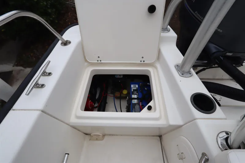 Slide: The Image of 2013 Boston Whaler 210 Montauk boat battery compartment with open hatch. - 24