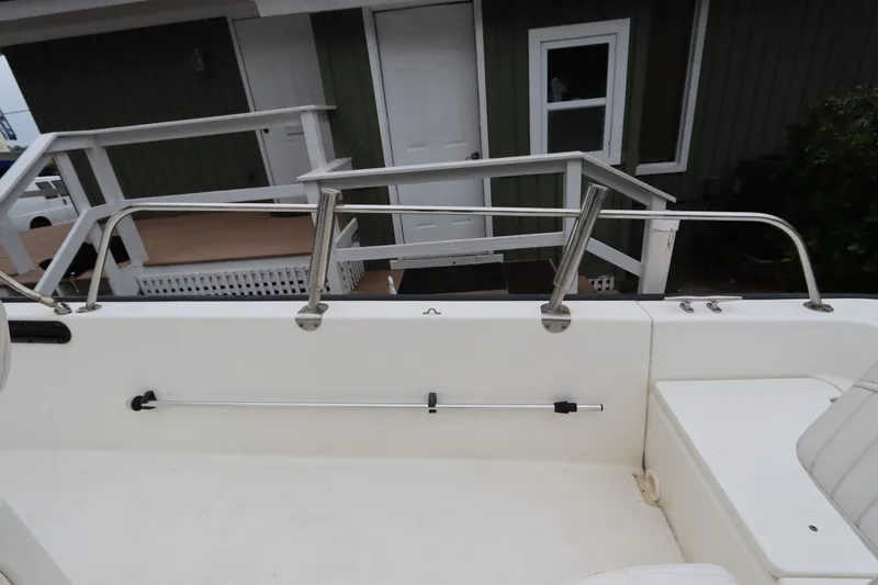 Slide: The Image of 2013 Boston Whaler 210 Montauk boat interior with railing and seating. - 27