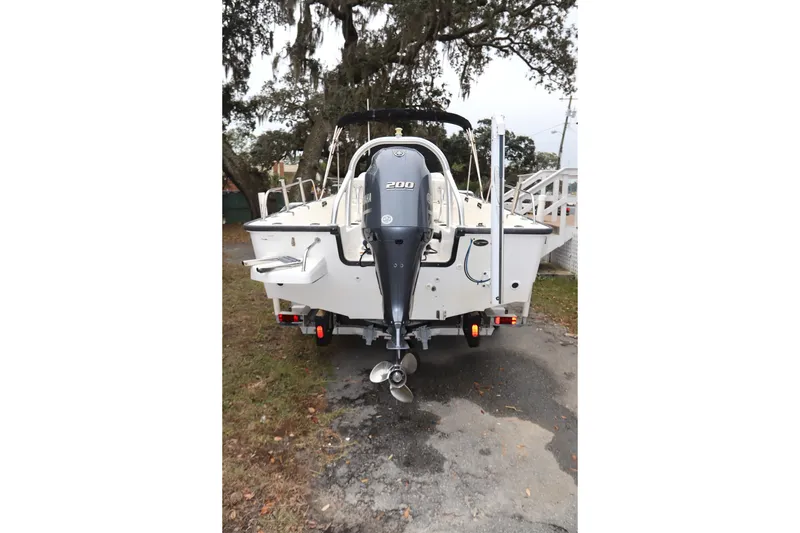 Slide: The Image of Rear view of 2013 Boston Whaler 210 Montauk boat with outboard motor. - 34