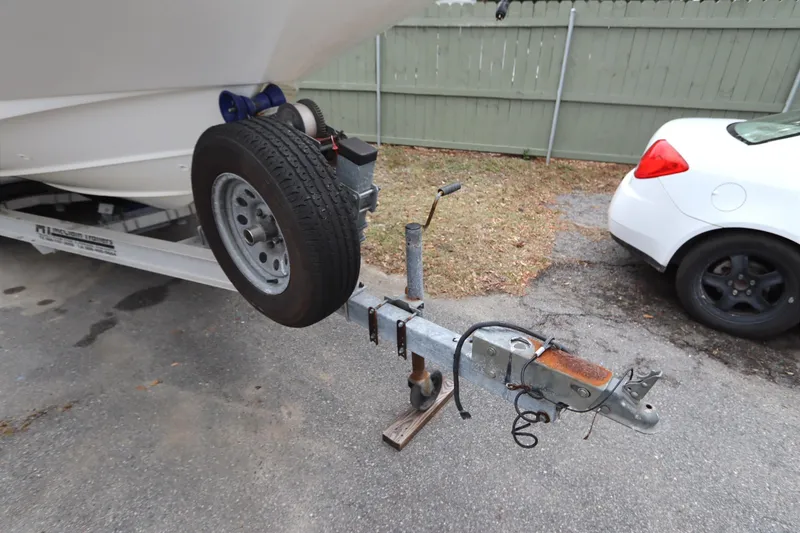 Slide: The Image of Trailer hitch of a 2013 Boston Whaler 210 Montauk boat, parked on pavement. - 35
