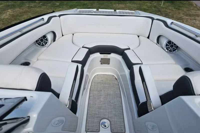Slide: The Image of Luxurious seating area of 2024 Crownline Eclipse E290 XS boat, featuring sleek white upholstery. - 12
