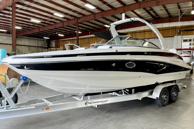 Slide: The Image of 2024 Crownline Eclipse E290 XS boat on trailer in parking lot. - 15