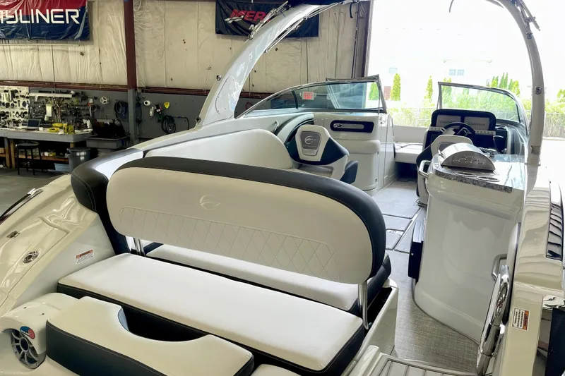 Slide: The Image of 2024 Crownline Eclipse E290 XS boat interior with luxurious seating and modern design. - 3