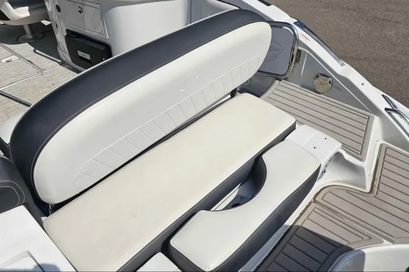 Slide: The Image of 2024 Crownline Eclipse E290 XS boat seating area with sleek design and comfortable upholstery. - 5