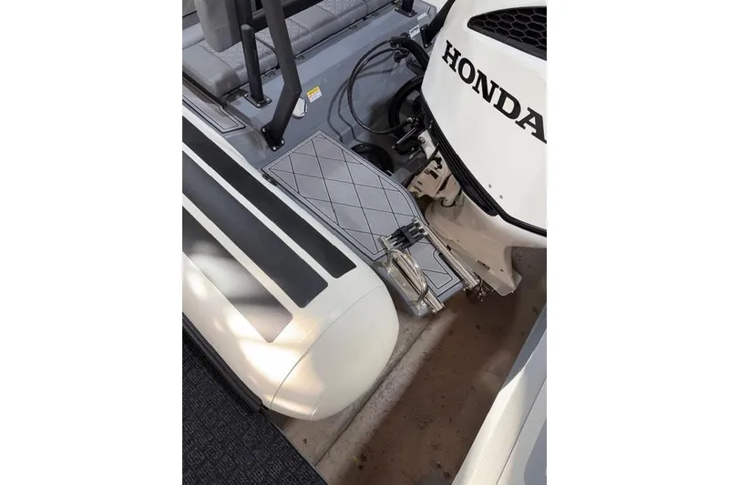 Slide: The Image of 2026 Brig Navigator 24 boat with Honda engine, featuring sleek design and durable materials. - 10