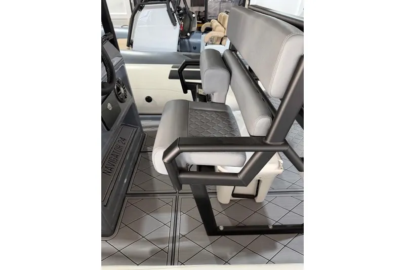 Slide: The Image of 2026 Brig Navigator 24 interior with modern seating and sleek design. - 7