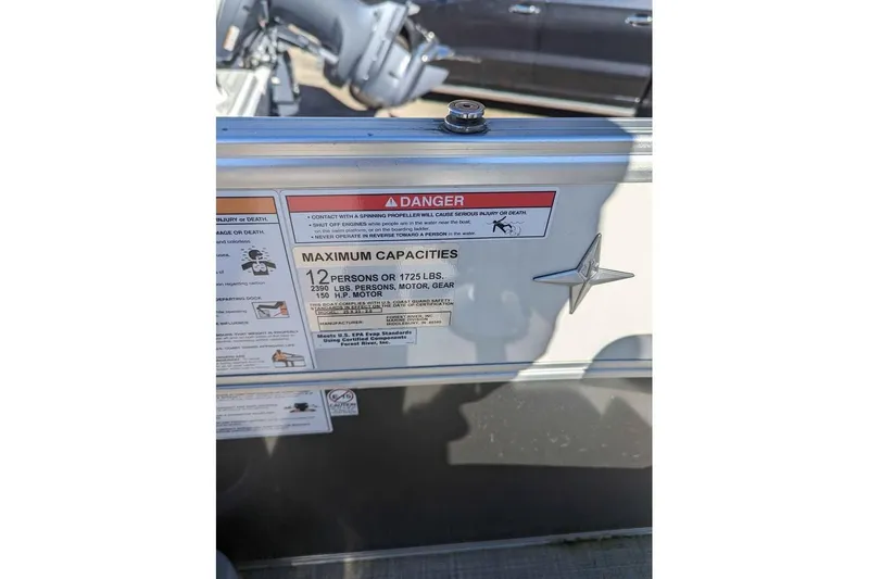 Slide: The Image of 2021 Berkshire 23ULX boat capacity label, showing maximum capacity of 12 persons or 1725 lbs. - 12