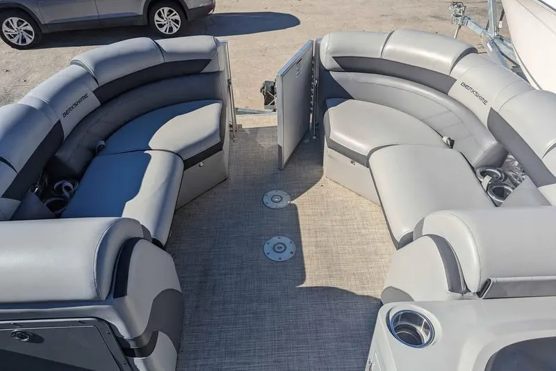 Slide: The Image of 2021 Berkshire 23ULX pontoon boat interior with gray seating and cup holders. - 9