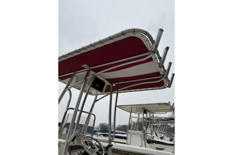 Slide: The Image of 2017 Carolina Skiff 218 DLV with red and white T-top canopy. - 4