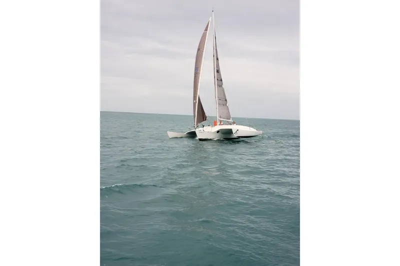 Slide: The Image of Sailing trimaran on open sea, Newick Native model, 1979. - 2