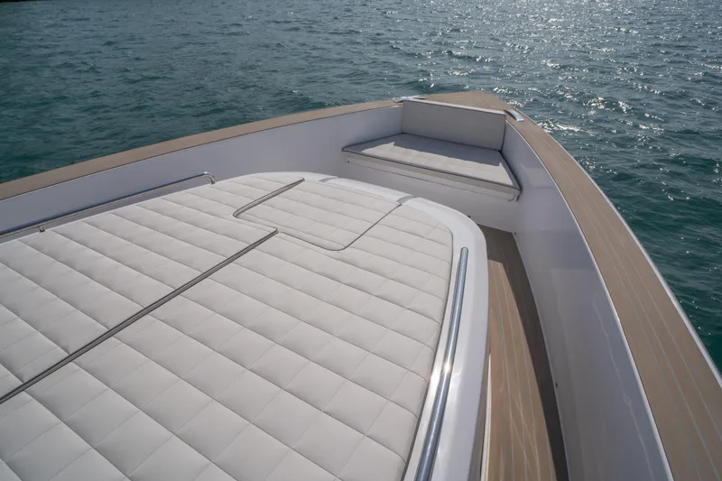 Slide: The Image of 2024 Pardo Yachts P43 interior with sleek seating and built-in storage, dockside view. - 19