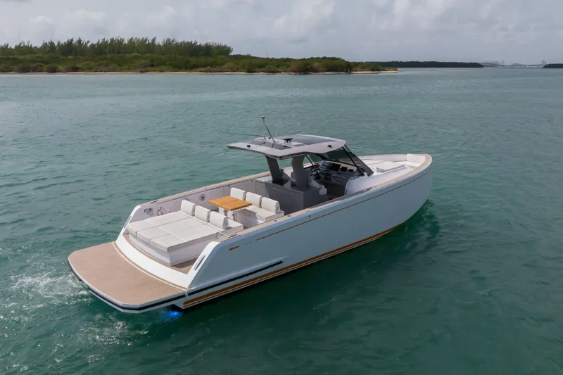 Slide: The Image of 2024 Pardo Yachts P43 luxury yacht on serene water, showcasing spacious deck design. - 2