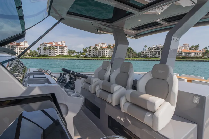 Slide: The Image of 2024 Pardo Yachts P43 deck with sunbed, cruising on calm blue waters. - 20