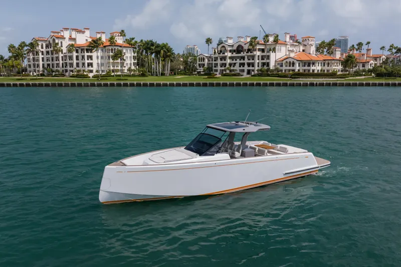 Slide: The Image of 2024 Pardo Yachts P43 luxury yacht on calm water, modern design, cityscape background. - 3