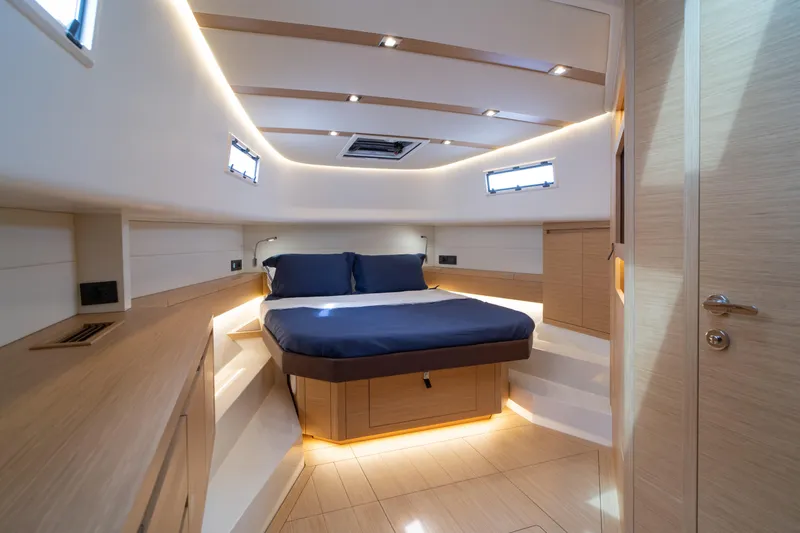 Slide: The Image of 2024 Pardo Yachts P43 helm with modern controls and scenic water view. - 34