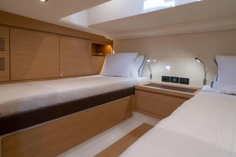 Slide: The Image of 2024 Pardo Yachts P43 deck with speaker, sleek design, and clear blue sky. - 37