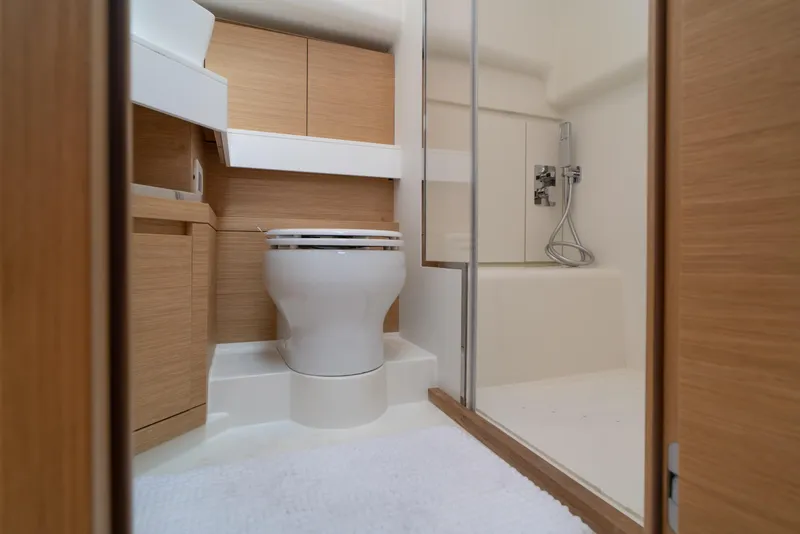 Slide: The Image of 2024 Pardo Yachts P43 luxury yacht deck with seating and table, overlooking serene waters. - 38