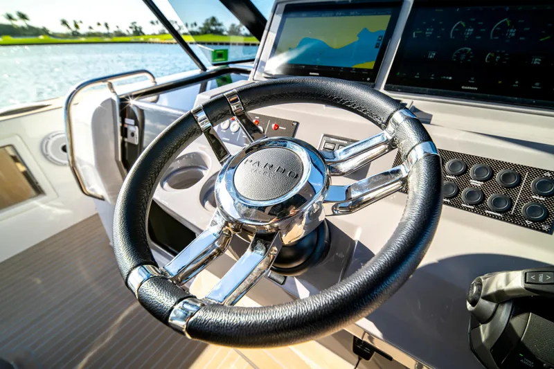 Slide: The Image of 2024 Pardo Yachts P43 luxury yacht on serene water with sun deck. - 45