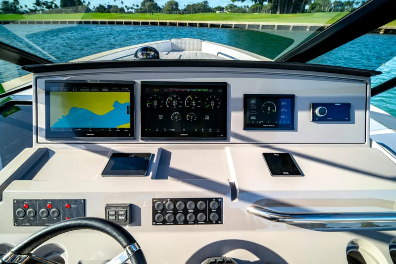 Slide: The Image of 2024 Pardo Yachts P43 deck with cushioned seating, overlooking blue water. - 46