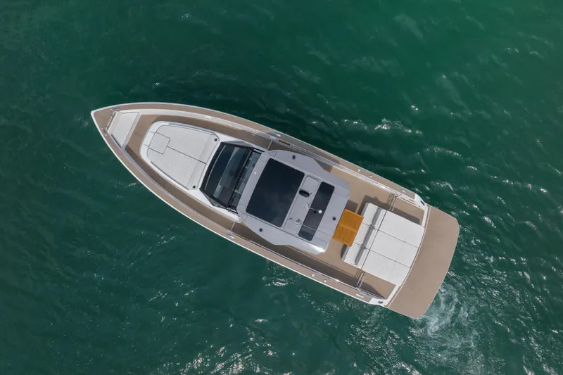 Slide: The Image of 2024 Pardo Yachts P43 luxury yacht on calm blue water, aerial view. - 8