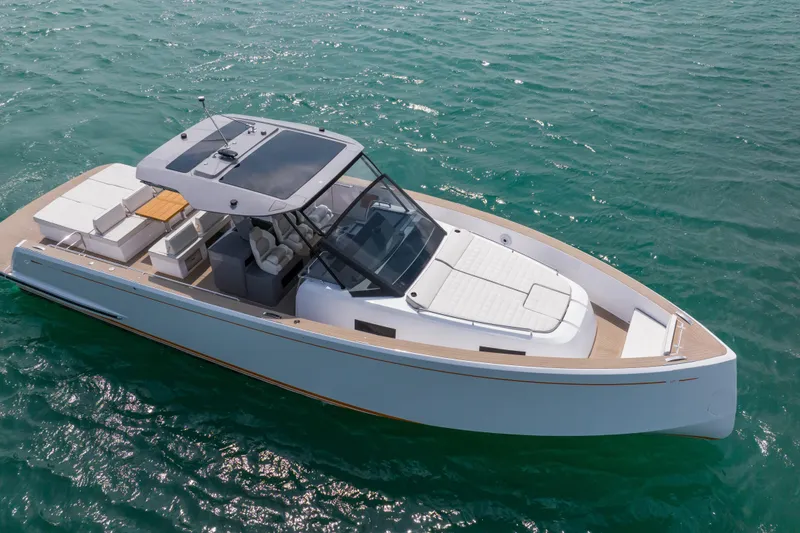 Slide: The Image of 2024 Pardo Yachts P43 cruising on a sunny day near lush greenery. - 1