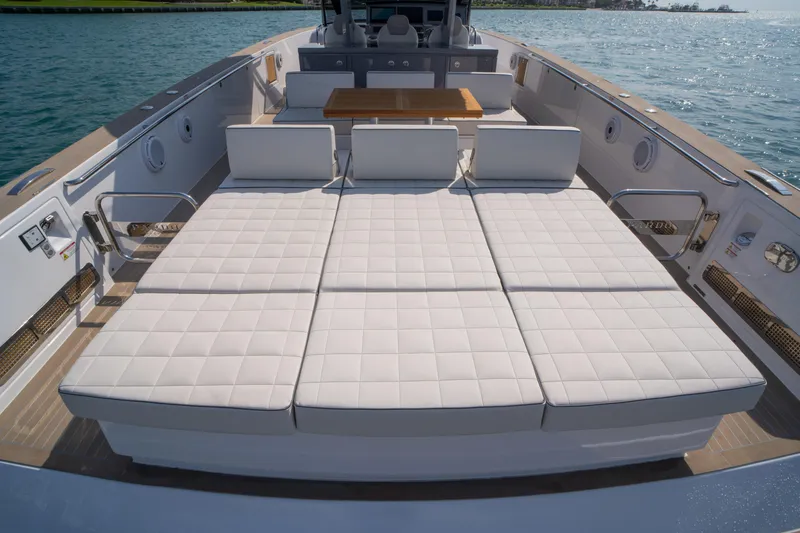 Slide: The Image of 2024 Pardo Yachts P43 luxury yacht on calm blue water. - 10