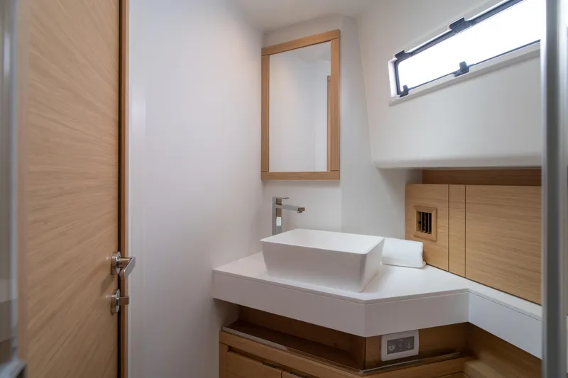 Slide: The Image of 2024 Pardo Yachts P43 luxury yacht cruising on a sunny day near lush greenery. - 17