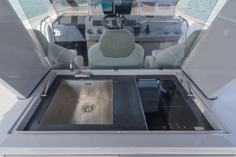 Slide: The Image of 2024 Pardo Yachts P43 luxury yacht with spacious sunbathing area on calm water. - 30