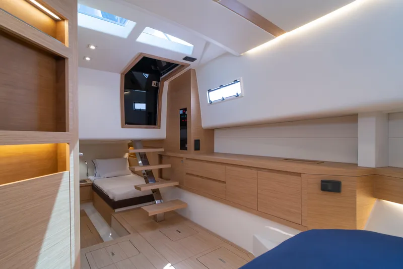 Slide: The Image of Interior view of 2024 Pardo Yachts P43 helm with modern controls and scenic waterway. - 35