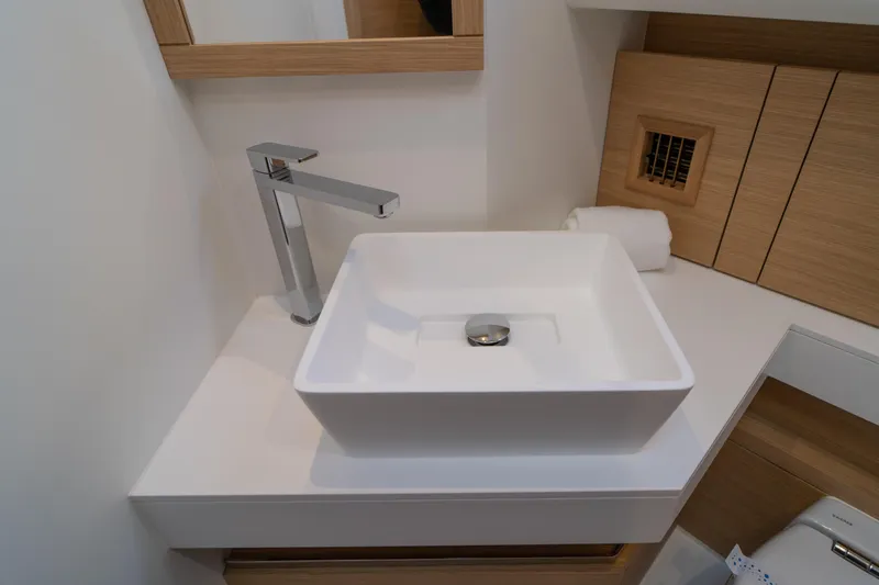 Slide: The Image of 2024 Pardo Yachts P43 luxury yacht deck with seating and table, overlooking serene waters. - 39