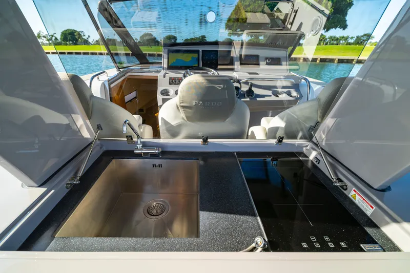 Slide: The Image of Luxurious interior cabin of 2024 Pardo Yachts P43, featuring modern wood finishes and ambient lighting. - 49