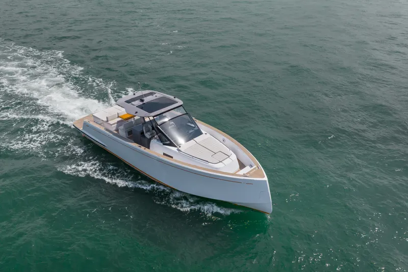 Slide: The Image of 2024 Pardo Yachts P43 luxury deck with seating and table on calm water. - 5