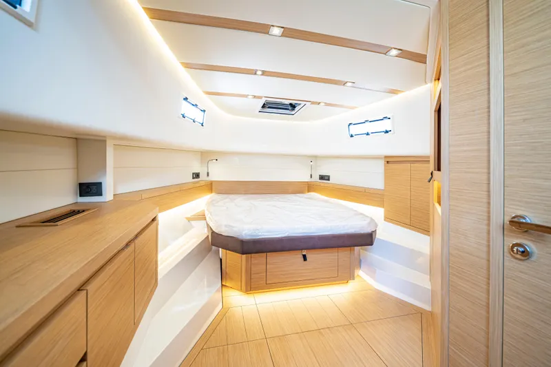 Slide: The Image of Luxurious interior cabin of 2024 Pardo Yachts P43 with modern wood finish. - 51