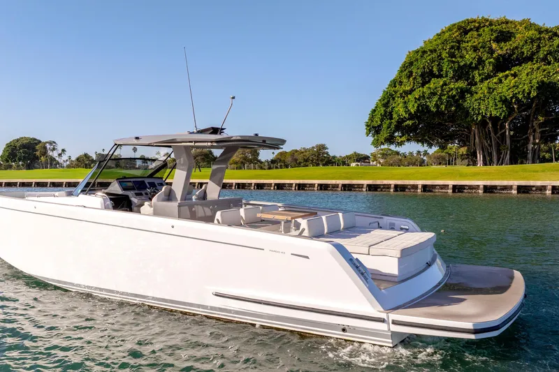 Slide: The Image of 2024 Pardo Yachts P43 luxury yacht on serene water, showcasing spacious deck design. - 55
