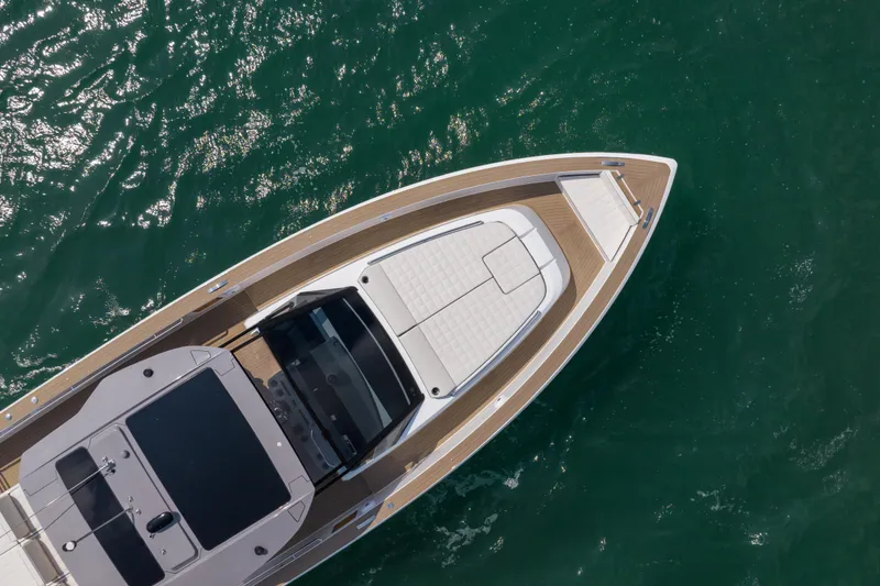 Slide: The Image of 2024 Pardo Yachts P43 luxury yacht on calm water, showcasing sleek design and spacious deck. - 7