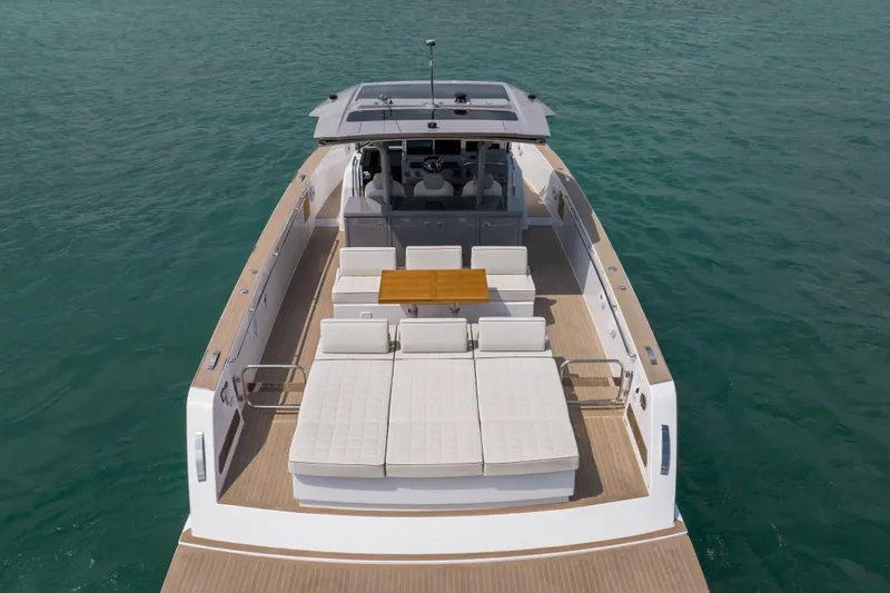 Slide: The Image of 2024 Pardo Yachts P43 luxury yacht on calm blue water. - 9