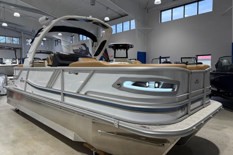 The Image of 2026 SunCatcher Diamond Elite 324 RC pontoon boat in showroom, featuring sleek design and modern amenities. - 0