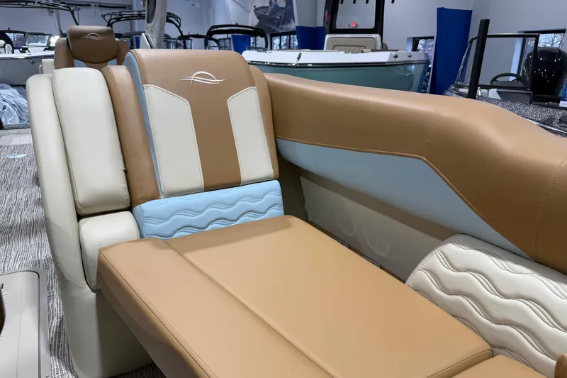 Slide: The Image of Luxurious seating on 2026 SunCatcher Diamond Elite 324 RC boat, featuring tan and cream upholstery. - 3