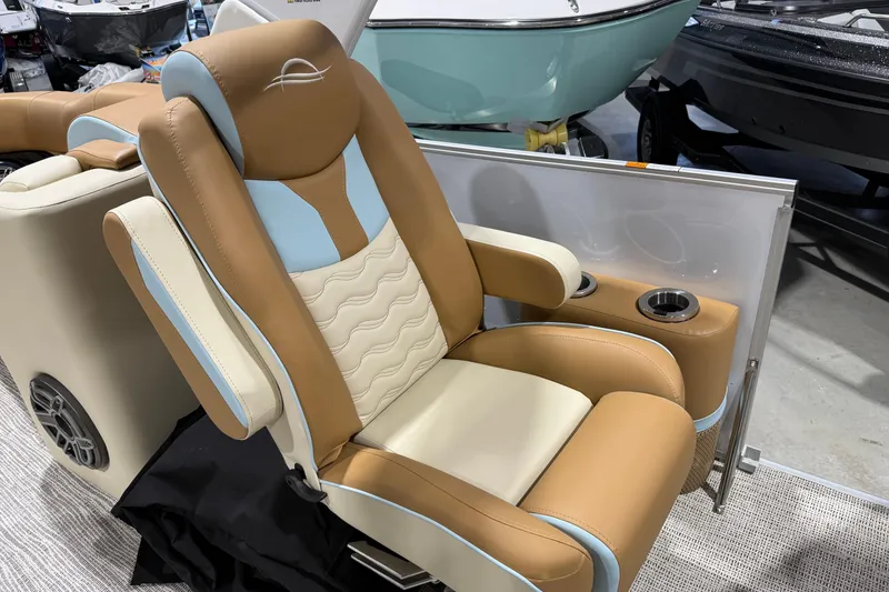 Slide: The Image of Luxurious seating on 2026 SunCatcher Diamond Elite 324 RC boat, featuring cup holders and premium upholstery. - 5