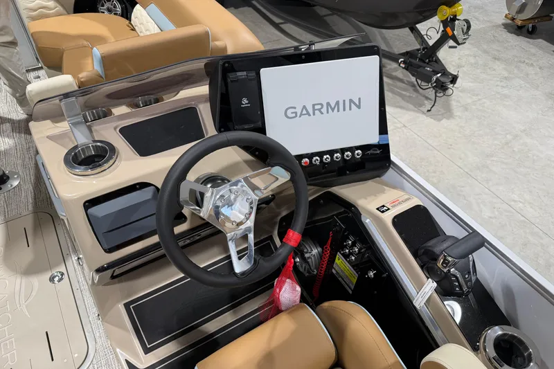 Slide: The Image of 2026 SunCatcher Diamond Elite 324 RC boat dashboard with Garmin navigation system. - 8