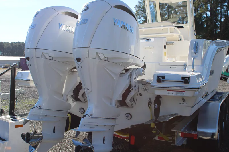 Slide: The Image of 2026 Sailfish 252 CC boat with dual Yamaha outboard engines, rear view. - 19