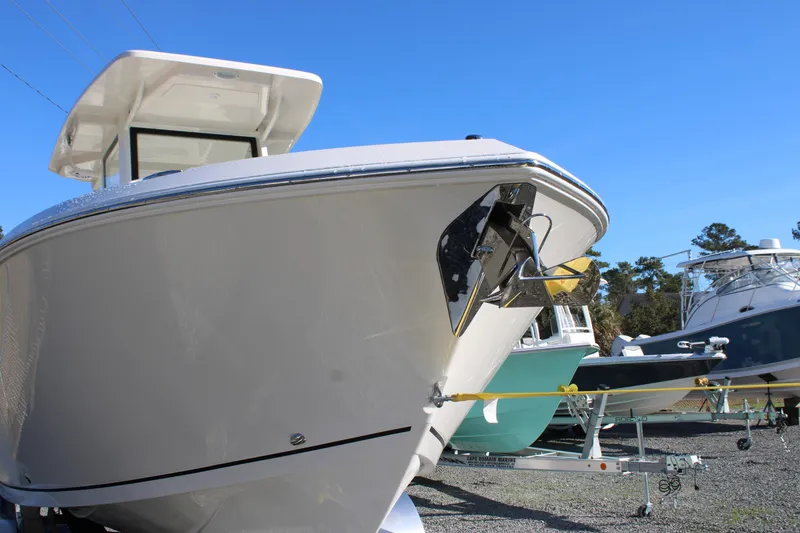 Slide: The Image of 2026 Sailfish 252 CC boat on display, showcasing sleek design and modern features. - 2