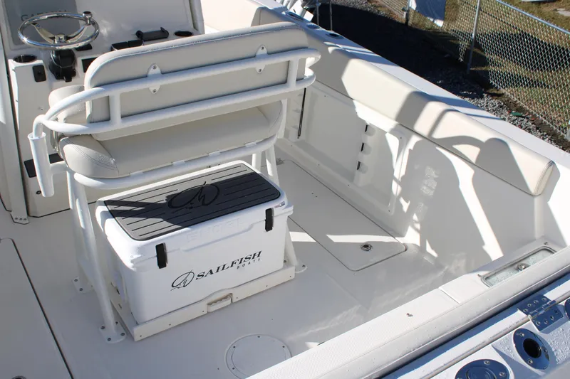 Slide: The Image of 2026 Sailfish 252 CC boat interior with seating and storage area. - 22