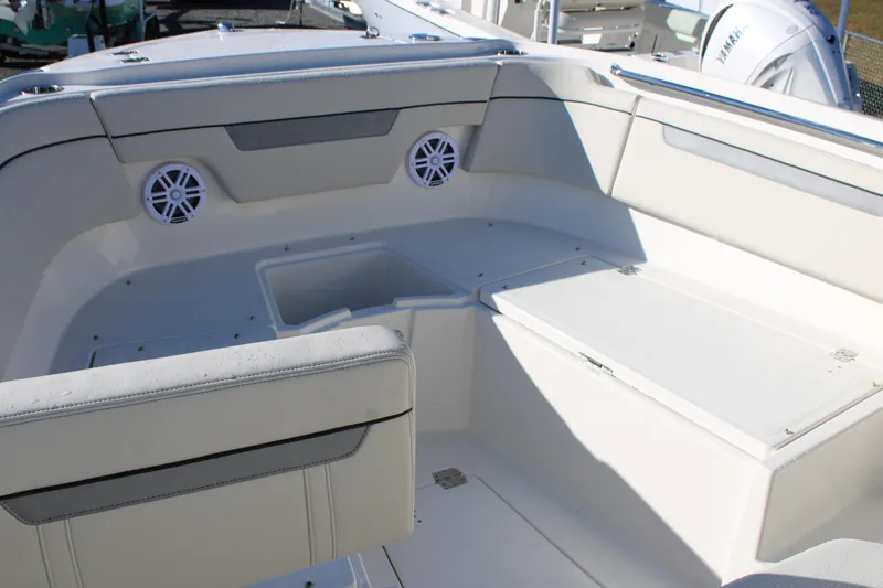 Slide: The Image of Interior of 2026 Sailfish 252 CC boat, featuring seating and storage compartments. - 24