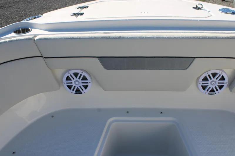 Slide: The Image of 2026 Sailfish 252 CC boat interior with speakers and cushioned seating. - 25